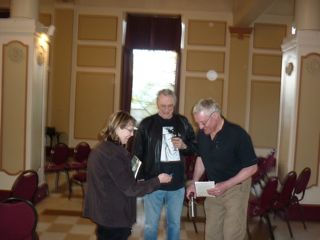 George Bowering and Ken Belford sign books for a poetry lover George Bowering and Ken Belford at Heritage Hall